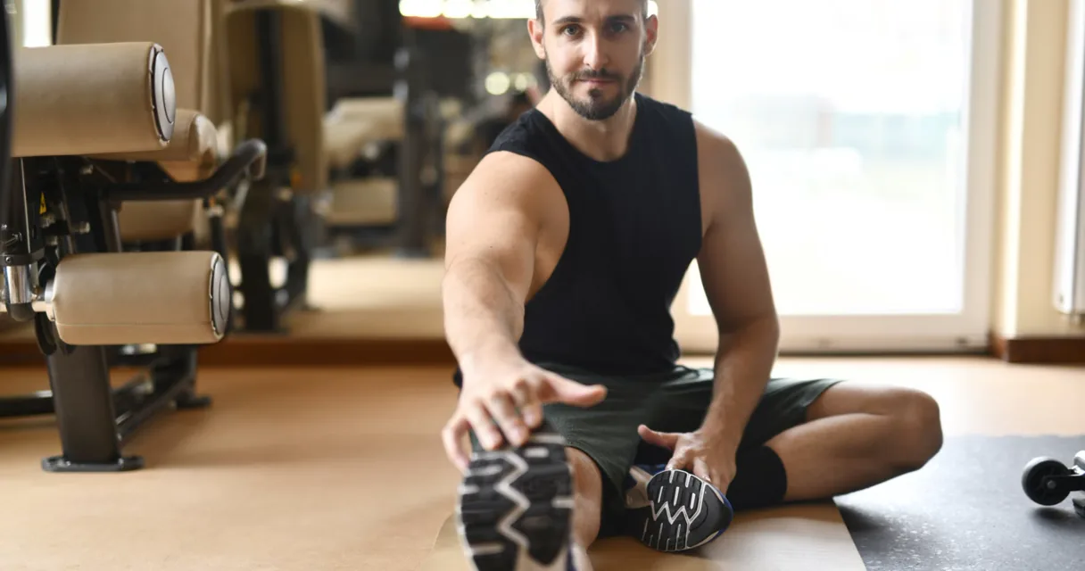 Athlete recovering after a controlled strength training workout