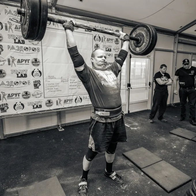 An athlete performing a perfect pull-up, symbolizing strength and injury prevention.